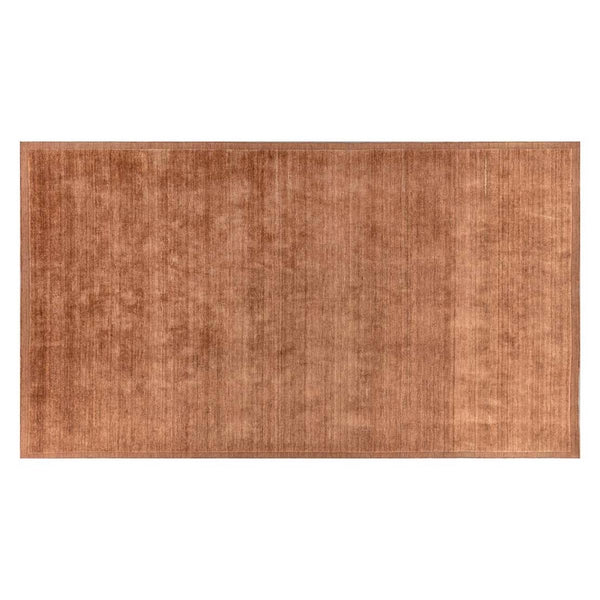 A full view of a handmade 100% wool rug by Globe West and Soren Liv NZ in a rich rust brown colour, with an indented border adding interest. 