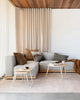 Warm toned, earthy coloured cushions by Baya nz decorating a couch in a modern living room