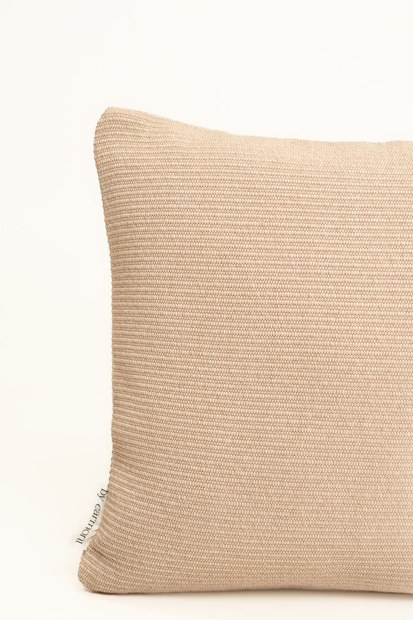 By Carmont Huxley cushion cover in Cameo, corner close-up showing the woven texture and brand label