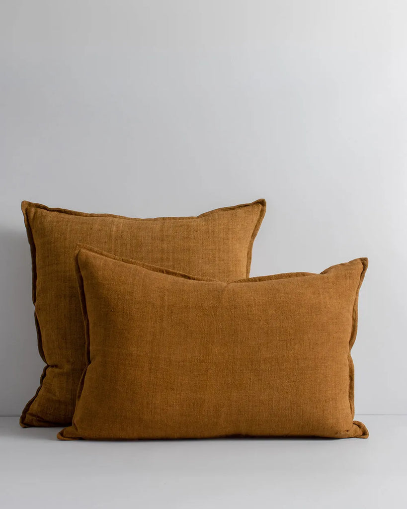 Baya Cassia square and Arcadia lumbar linen cushions in tobacco brown colour