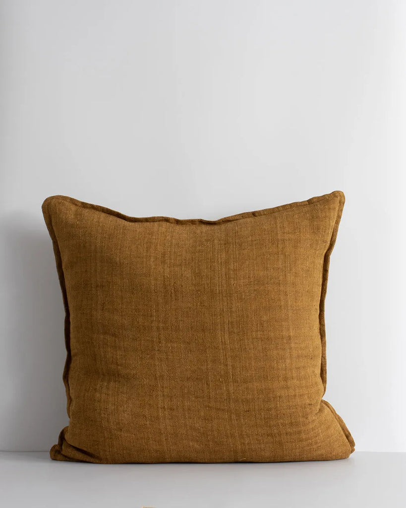 The Baya Cassia linen cushion, with flange detail, in colour tobacco brown