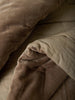 Città Cotton Velvet Quilt in Doe, fold detail showing the reverse fabric.
