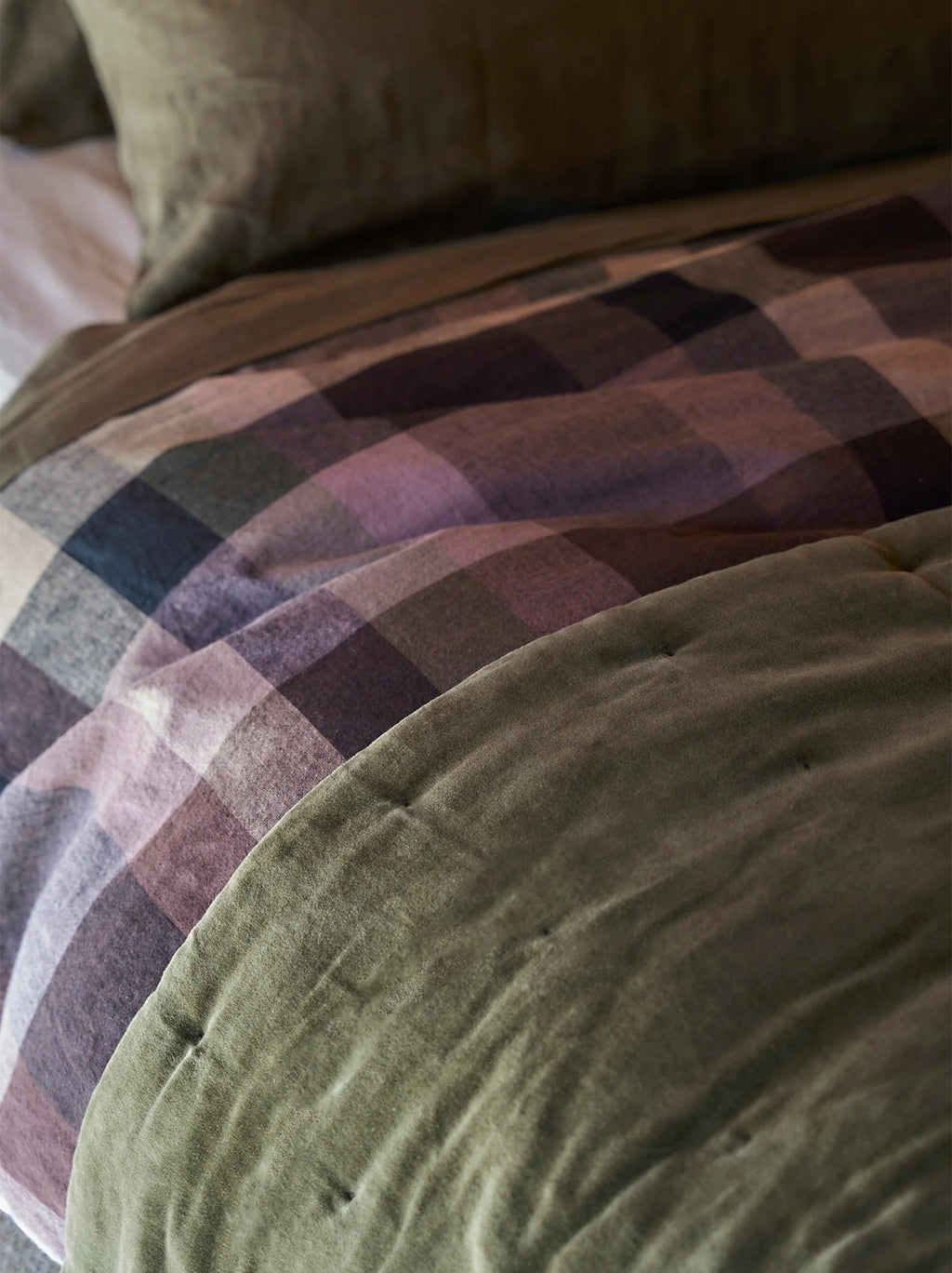 Close view of the soft cotton velvet surface and quilted stitching on the Ivy quilt