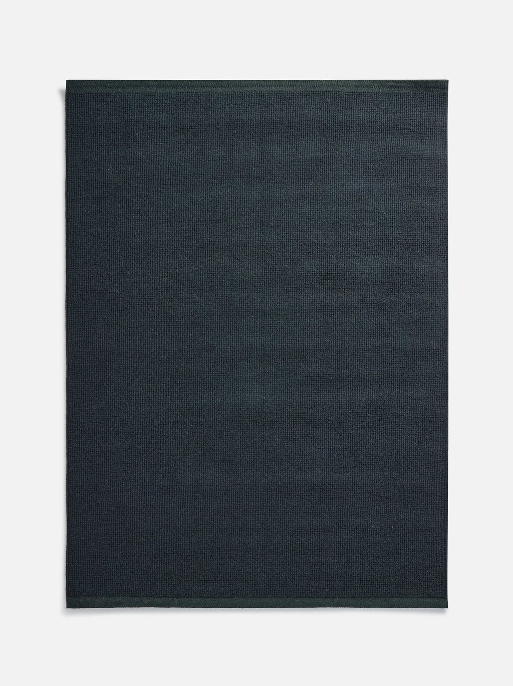Città Joni Wool Mat in Baltic/Pine, full flat lay view of the mat.