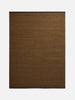 Città Joni Wool Mat in Kelp/Umber, flat lay showing the olive-brown body with dark brown trim at each end.