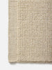 Città Joni Wool Mat in Oatmeal, close view of the popcorn-style woven texture.