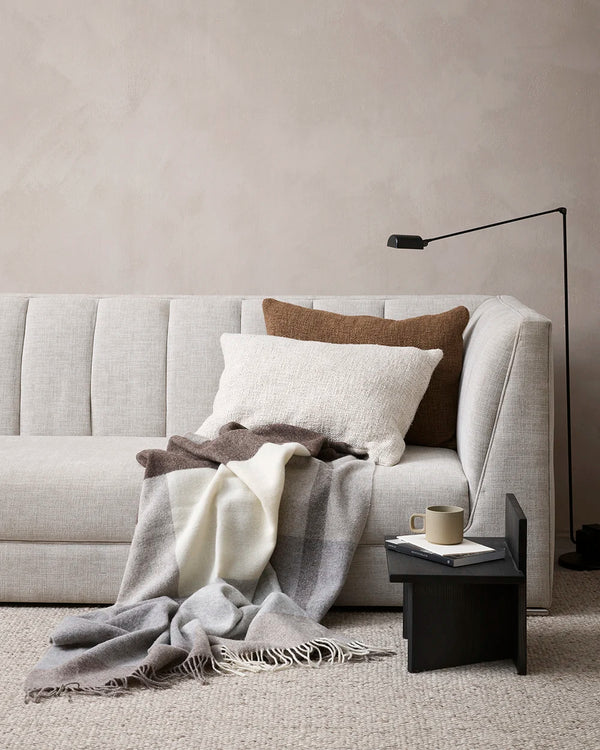 Baya 'Cyprian ' textural cushions in cream 'Oatmeal' and brown 'Cocoa' decorating a couch in a modern lounge room