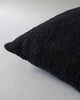 Close upo of the textural detail and edge of the Baya cyprian cushion in black