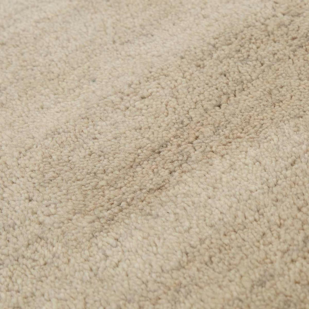 Close up of a soft handloomed rug in a soft beige Pumice colour by Soren Liv