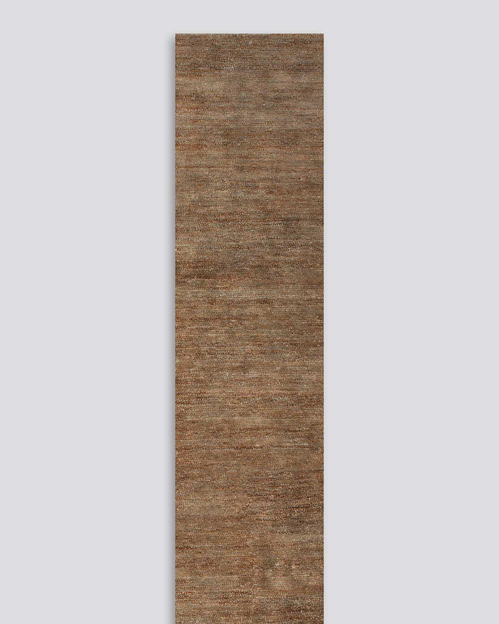 A full image of the Fairbanks floor runner in shade Sand, a deliciously warm toned brown handwoven piece with bamboo silk and jute. 