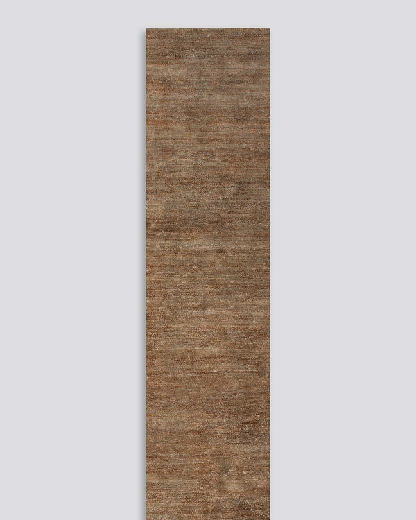 A full image of the Fairbanks floor runner in shade Sand, a deliciously warm toned brown handwoven piece with bamboo silk and jute. 