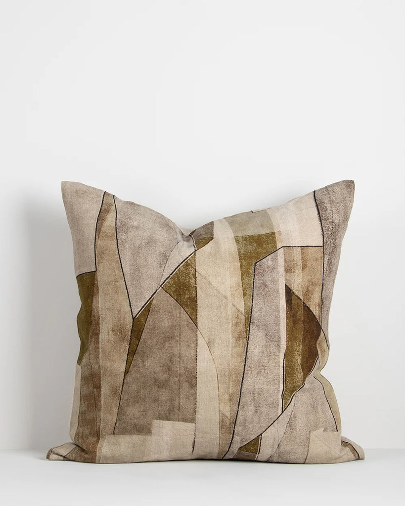 The Baya 'Grove Olive' cushion featuring an abstract print in brown and green tones