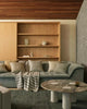 Home decor items including cushions and the Piazza throw, by Weave Home nz, seen in a contemporary living room