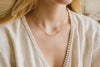 A beautiful yellow gold necklace, intricate and delicate. 