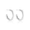Two hoop earrings in sterling silver with chunky details by Linda Tahija. 