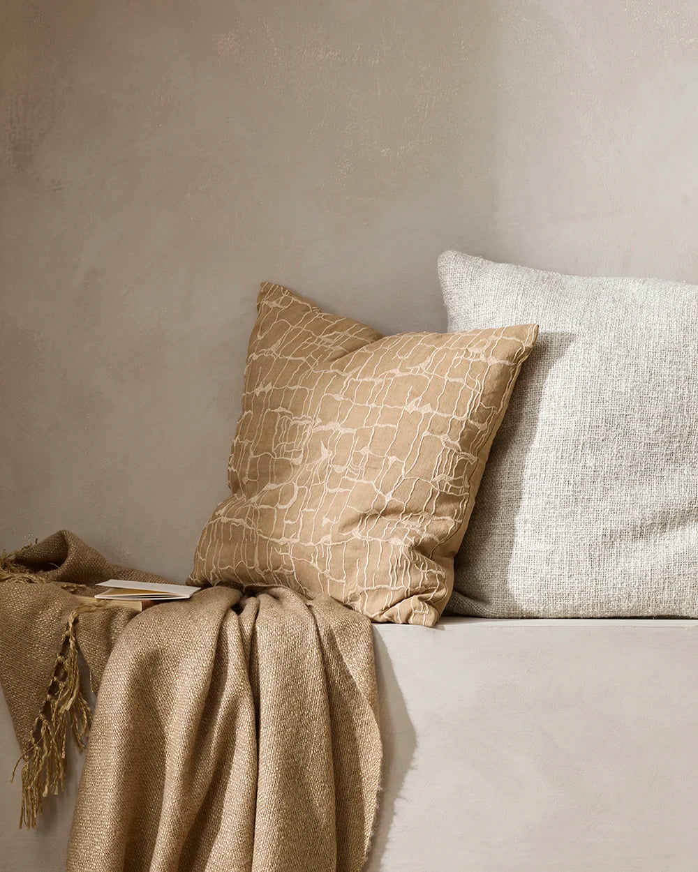 Brown patterned 'Triton' cushion, with the cream 'Cyprian' cushion and nid brown throw blanket