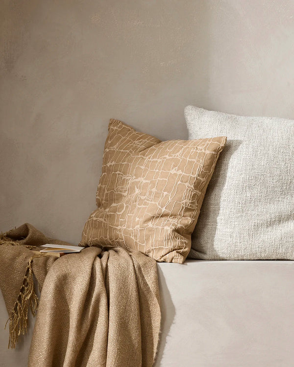 Brown patterned 'Triton' cushion, with the cream 'Cyprian' cushion and nid brown throw blanket