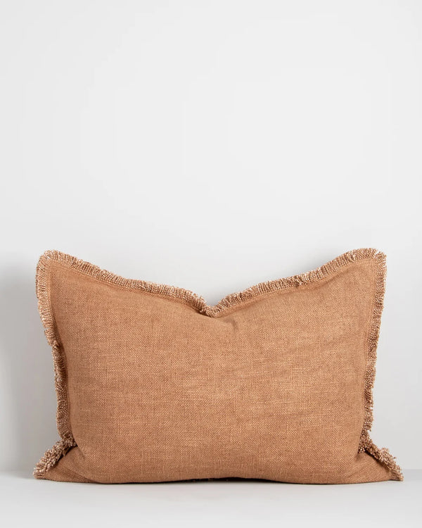 Pink clay-toned lumbar cushionn with a soft fringed detail surround, by Baya nz