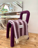 Maison Deux Candy Wrap wool throw in Lilac Aubergine, styled in a room setting.