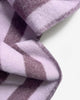 Close-up of the Maison Deux Candy Wrap wool throw in Lilac Aubergine, showing the woven stripe texture.