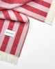 Close-up of the Maison Deux Candy Wrap wool throw in Pink Cherry, showing the woven stripe texture.