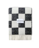 Maison Deux Checkerboard wool throw in Black White, folded with the Maison Deux label visible.
