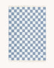 Maison Deux Checkerboard wool throw in Denim White, folded flat with the full blue and white pattern visible.