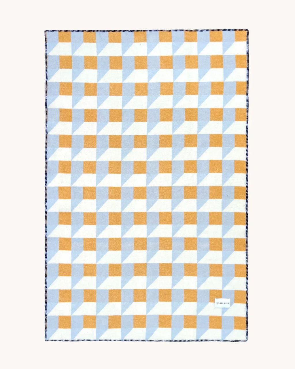 Maison Deux Cubics wool throw in Blue Honey, spread flat to show the full blue, mustard and cream cube pattern