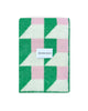 Maison Deux Cubics wool throw in Grass Pink, folded to show the cube pattern and the woven Maison Deux label