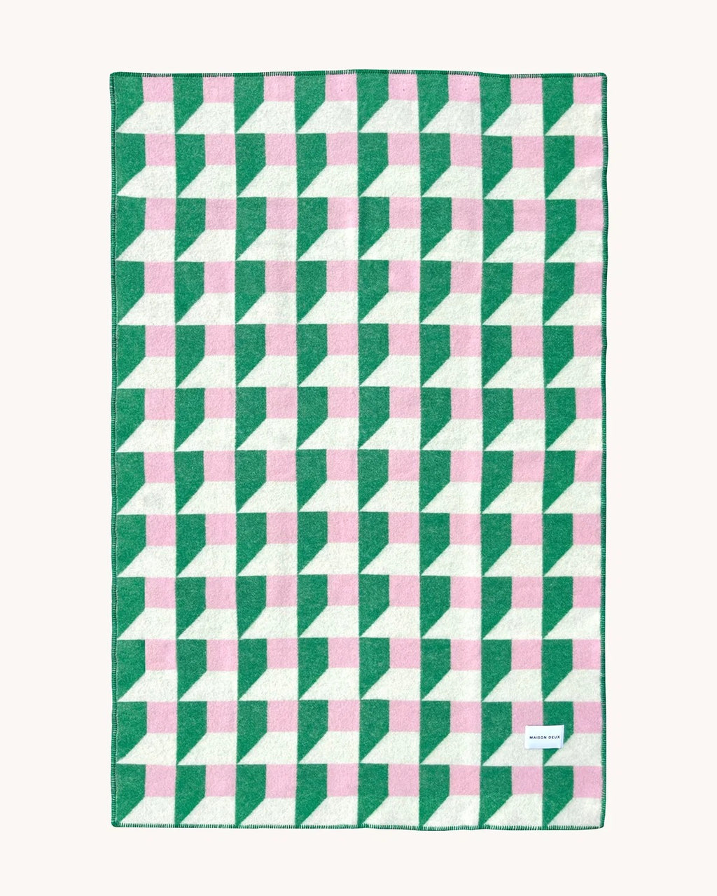 Maison Deux Cubics wool throw in Grass Pink, spread flat to show the full green, pink and cream cube pattern