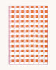 Maison Deux Cubics wool throw in Pink Carrot, spread flat to show the full pink, coral and cream cube pattern