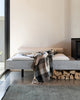 Nz made wool throw blanket in a modern plaid featuring blush browns, black and cream, in a modern home