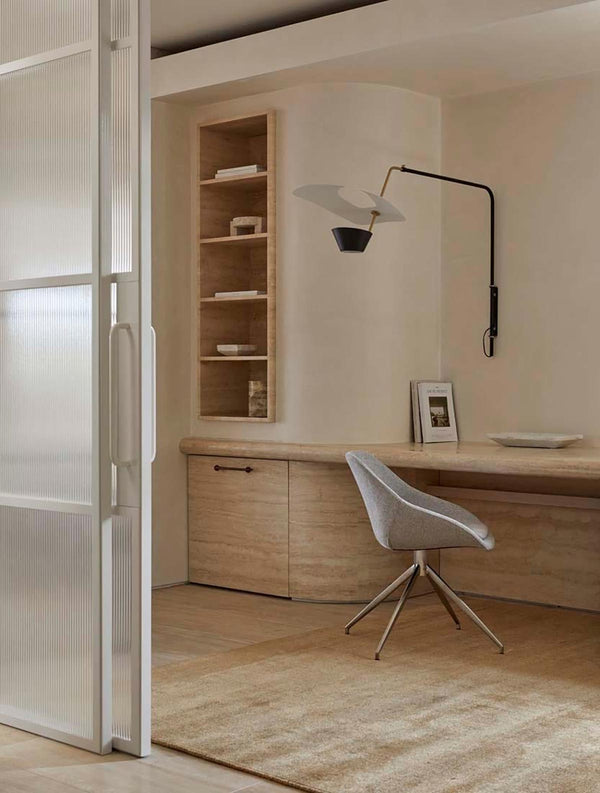 A modern office area with a warm, light honey mustard brown wool blend rug by Globe West and Soren Liv NZ