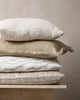 Stack of neutral cushions by Baya nz