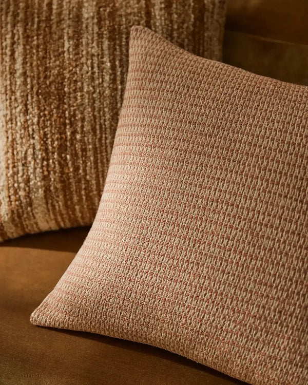 Blush pink textural cushion by Weave Home nz , shown next to a brown textured cushion