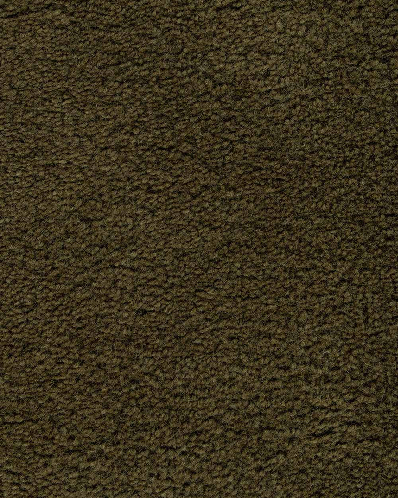 A close up of the weave of the Norfolk floor rug in Olive. The luxurious depth of the pile and sumptuous on-trend deep green colour make this rug a standout. 