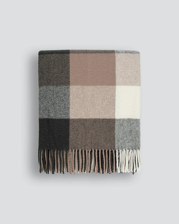 Nz made wool throw blanket in a modern plaid featuring blush browns, black and cream