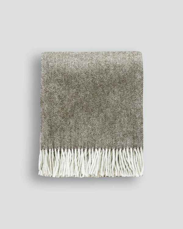 Baya NZ wool throw blanket featuring twill weave, tasselled fringe and a trending olive tone