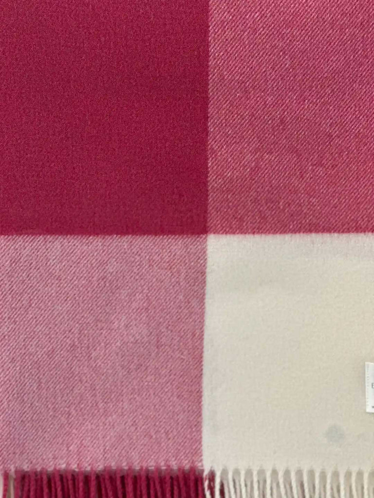 Close up of a NZ merino wool throw blanket in a pink and white check, by Exquisite Wool Blankets