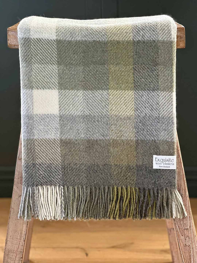 Pure nz wool throw blanket, by Exquisite Wool Traders, in olive green and white plaid