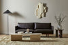 A soft, wool blend rug in shades of muted olive green by Soren Liv NZ and Globe West, situated in a stylish modern living room. 