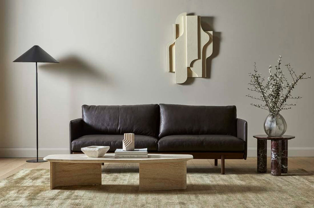 A soft, wool blend rug in shades of muted olive green by Soren Liv NZ and Globe West, situated in a stylish modern living room. 