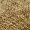 Close up of the weave of a soft, wool blend rug in shades of muted olive green by Soren Liv NZ and Globe West.