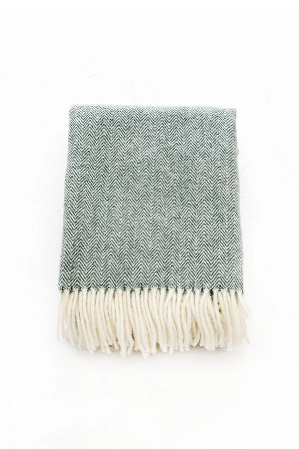 Palliser Ridge Herringbone throw in Forest folded flat, showing the herringbone weave
