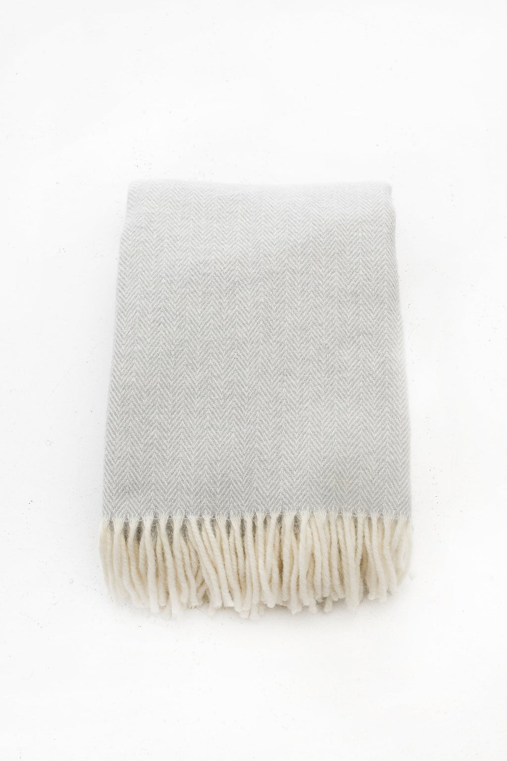 Palliser Ridge Herringbone throw in Dove Grey folded flat, showing the herringbone weave