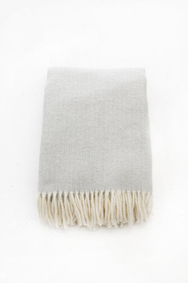 Palliser Ridge Herringbone throw in Dove Grey folded flat, showing the herringbone weave