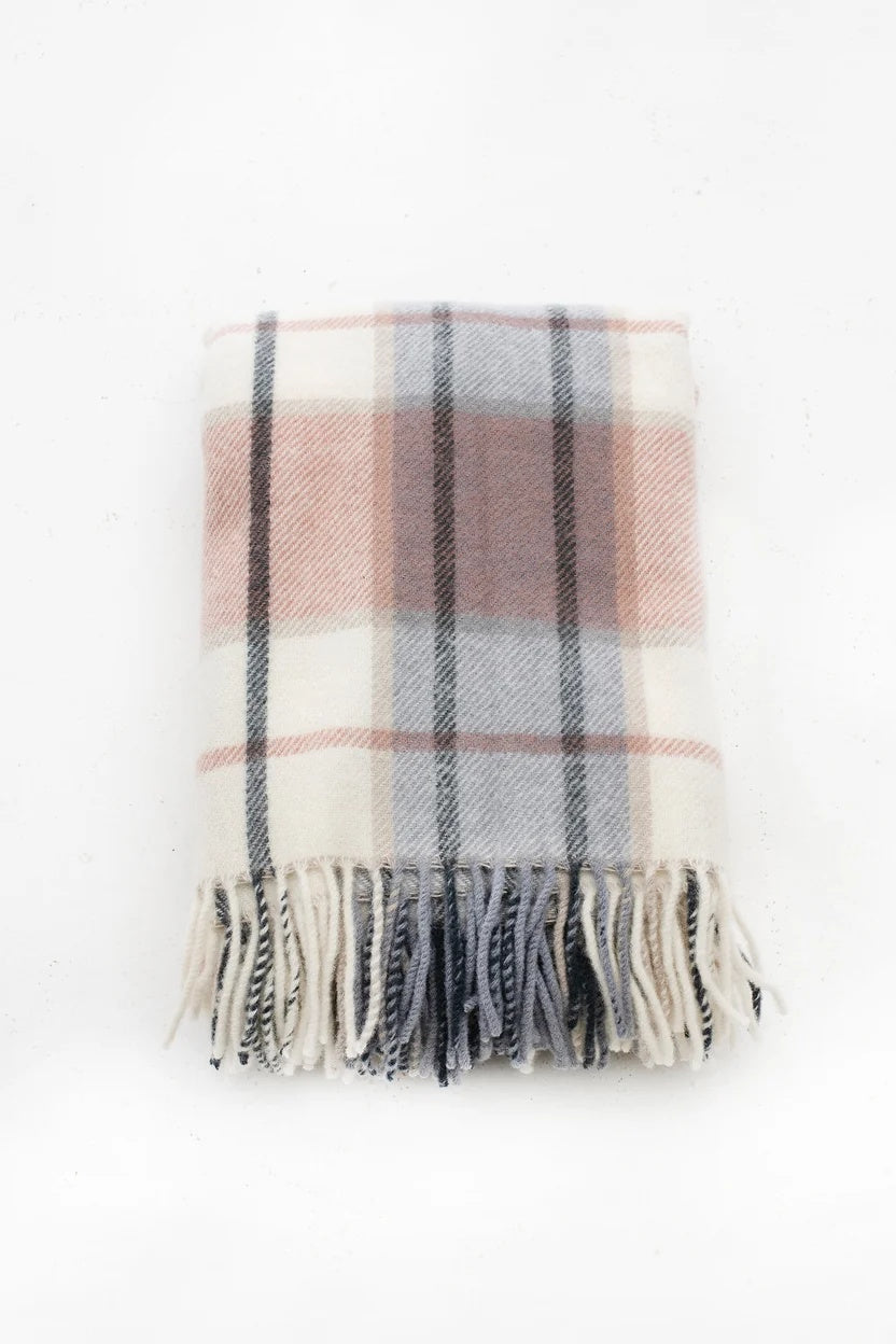 Palliser Ridge Twill Check lambswool throw in Blush, folded to show the check pattern and fringed edge