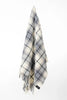 Palliser Ridge Twill Check lambswool throw in Dove Grey, hanging to show the full check pattern