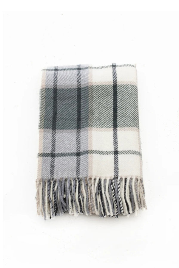 Palliser Ridge Twill Check lambswool throw in Forest, close view of the check pattern and fringed edge