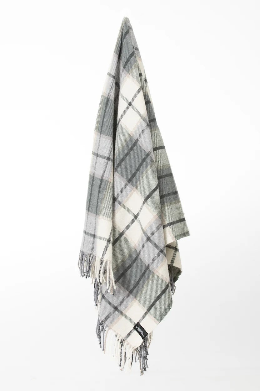 Palliser Ridge Twill Check lambswool throw in Forest, hanging to show the full check pattern